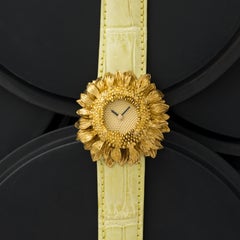 Asprey Armbanduhr aus 18 Karat Gelbgold mit Sonnenblumen-Quarz, um 1990, Schweizer Fabrikat