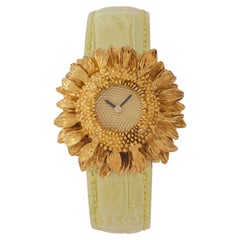 Asprey Armbanduhr aus 18 Karat Gelbgold mit Sonnenblumen-Quarz, um 1990, Schweizer Fabrikat