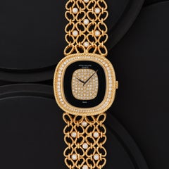 Vintage Patek Philippe Ellipse Model 4433/1 18 Karat Yellow Gold Onyx Diamond