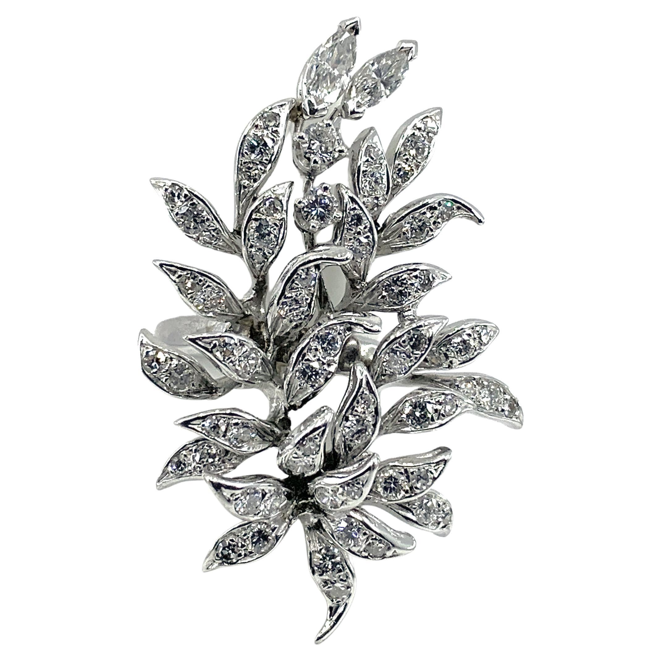 This fantastic ring started out in life as a diamond brooch, but Eytan thought it would be more interesting as a ring, so he attached it to a white gold band and -- voila! -- a festive and delightfully sexy sprawl of leafy sparkle for your