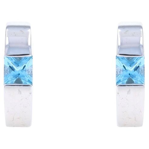 Boucles d'oreilles Huggie en or blanc avec topaze bleue - 14k Carré .74ctw Pierce