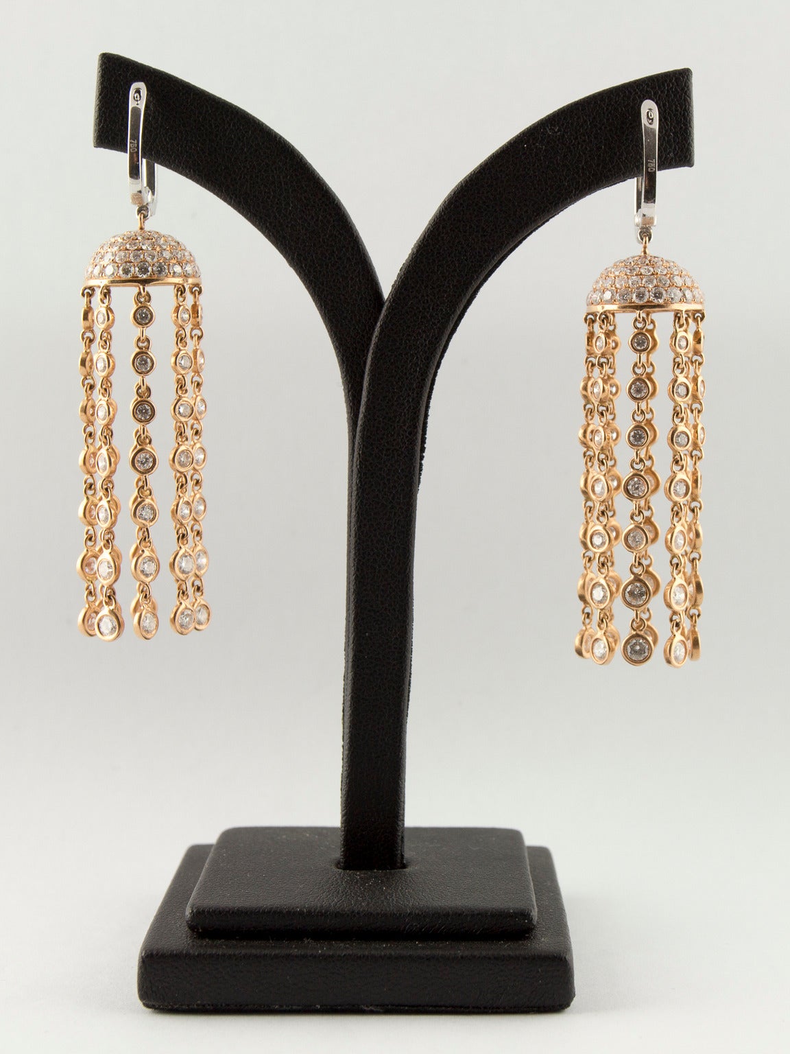 Pair of handcrafted 18ct white and rose gold diamond waterfall chandelier drop earrings, each with a white gold hinged hoop to set with 11 brilliant cut diamonds from which is suspended a rose gold half dome-shaped bell cap pave set with 79