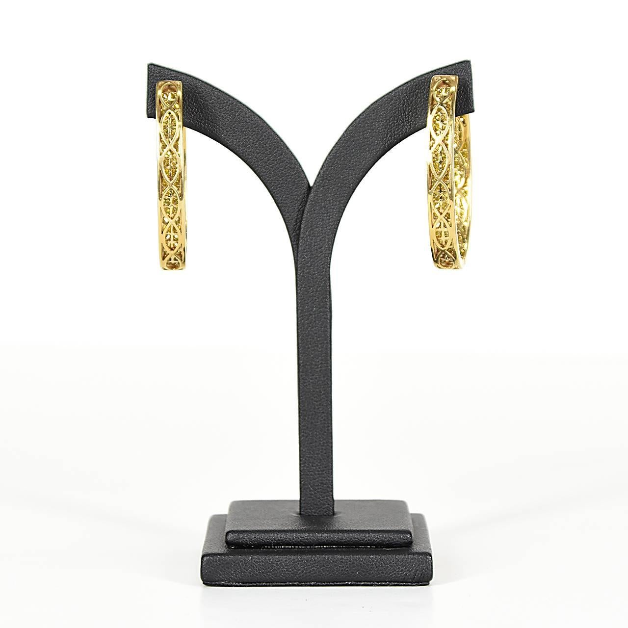 Pair of 18ct yellow gold oval shaped hinged diamond hoop earrings, set to fronts and reverse with square princess-cut yellow diamonds, total estimated weight 5.04ct. Diamond clarity : SI
Independent valuation in Australian dollars