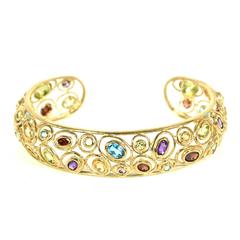 Multi-Gem Elliptical Gold Bangle