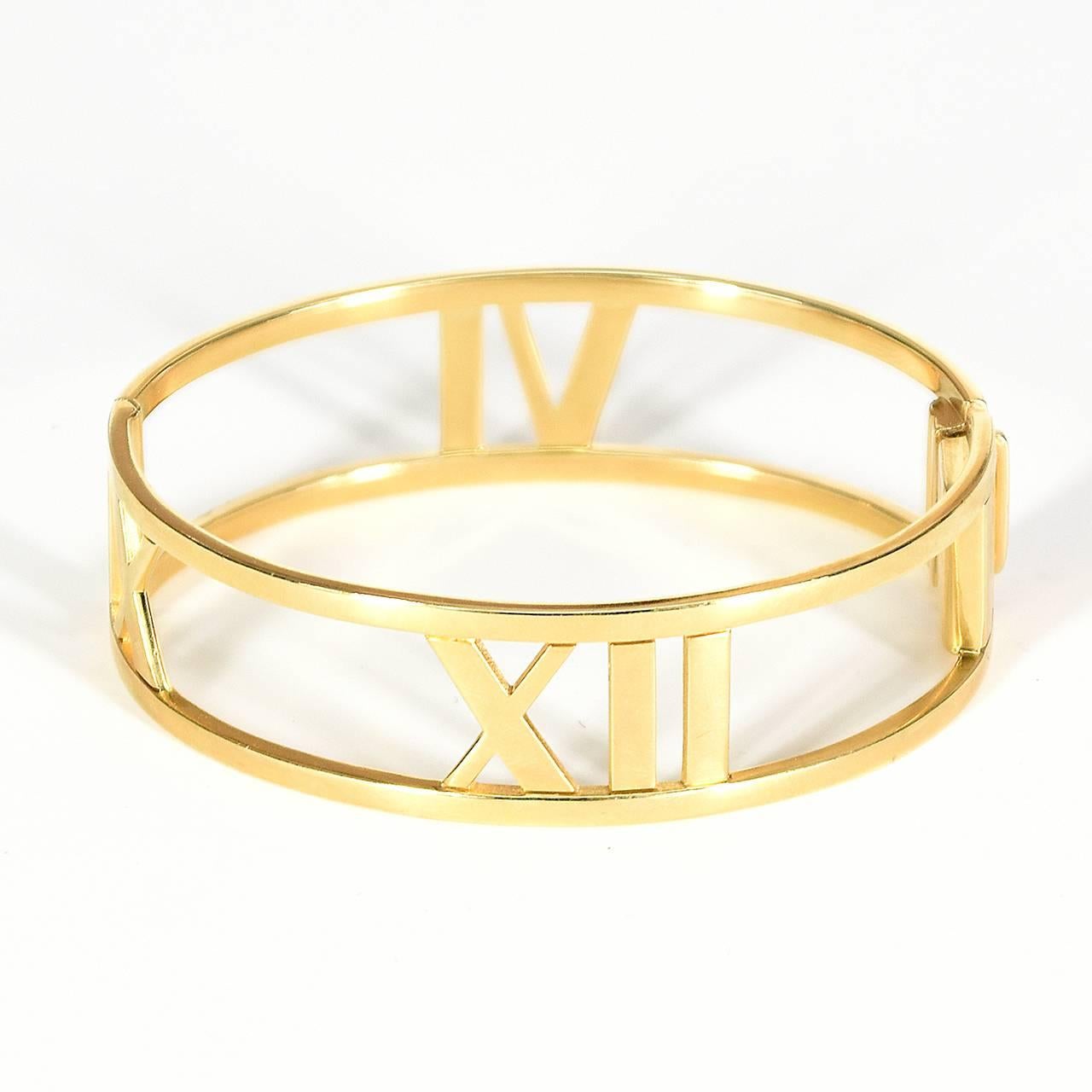 18ct yellow gold medium sized 'Atlas' hinged bangle with a design of Roman Numerals.  The outer band of the bangle is stamped T. & Co. AU 750 Italy together with Atlas and the copyright symbol.
Independent valuation in Australian dollars