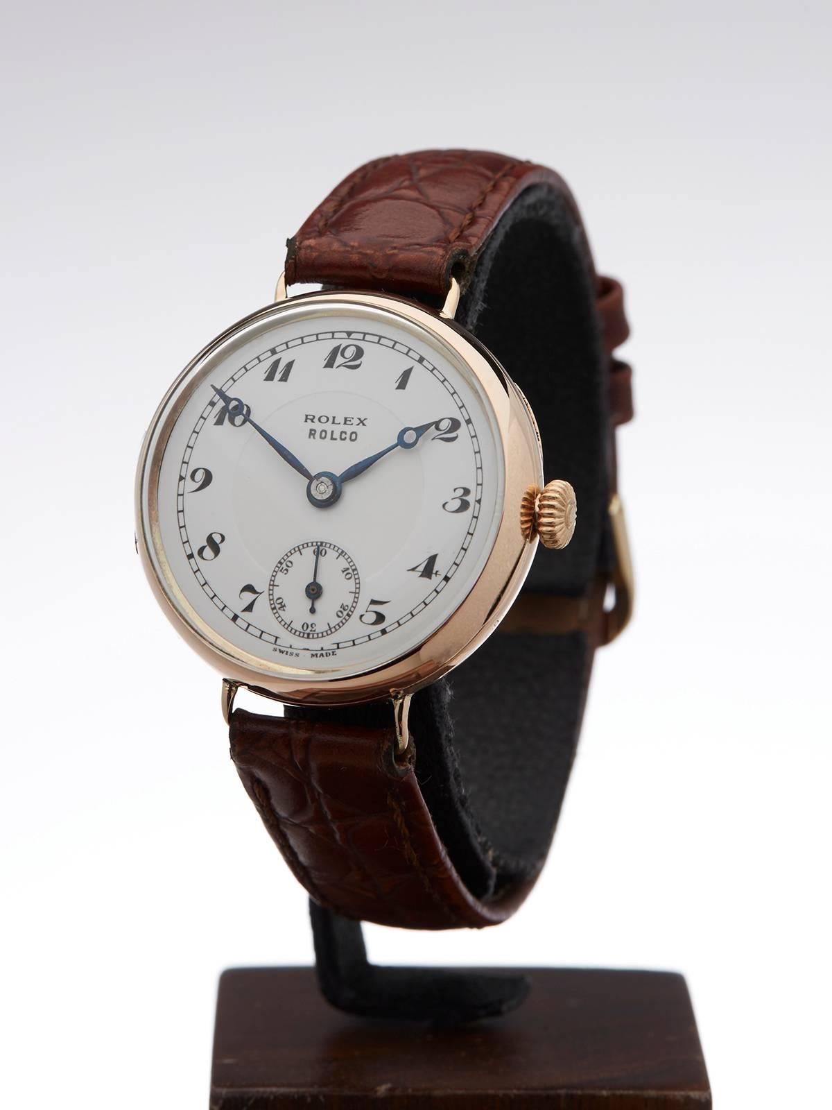 Ref 	COM809
Condition 	9 - Excellent condition
Gender 	Unisex
Age 	1910's
Case Diameter 	30 mm
Case Size 	30mm
Box & Papers 	xupes Presentation Pouch
Movement 	Mechanical Wind
Case 	9k Rose Gold
Dial 	White
Bracelet 	Brown leather
Strap Length