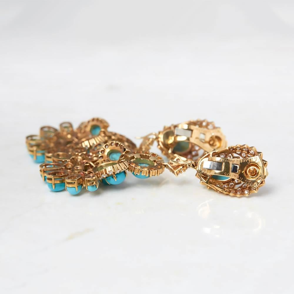 Ref: COM988
Serial Number: NY *****
Age: 1970's
Size: Earring Length - 8cm, Earring Width - 3cm
Box & Papers: Xupes Presentation Box
Material: 18k Yellow Gold, total weight - 47.56 grams
Gemset: Set with 34 oval cabochon Persian Turquoise of