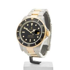 Rolex Submariner Stainless Steel and 18 Karat Yellow Gold Gents16613, 1989