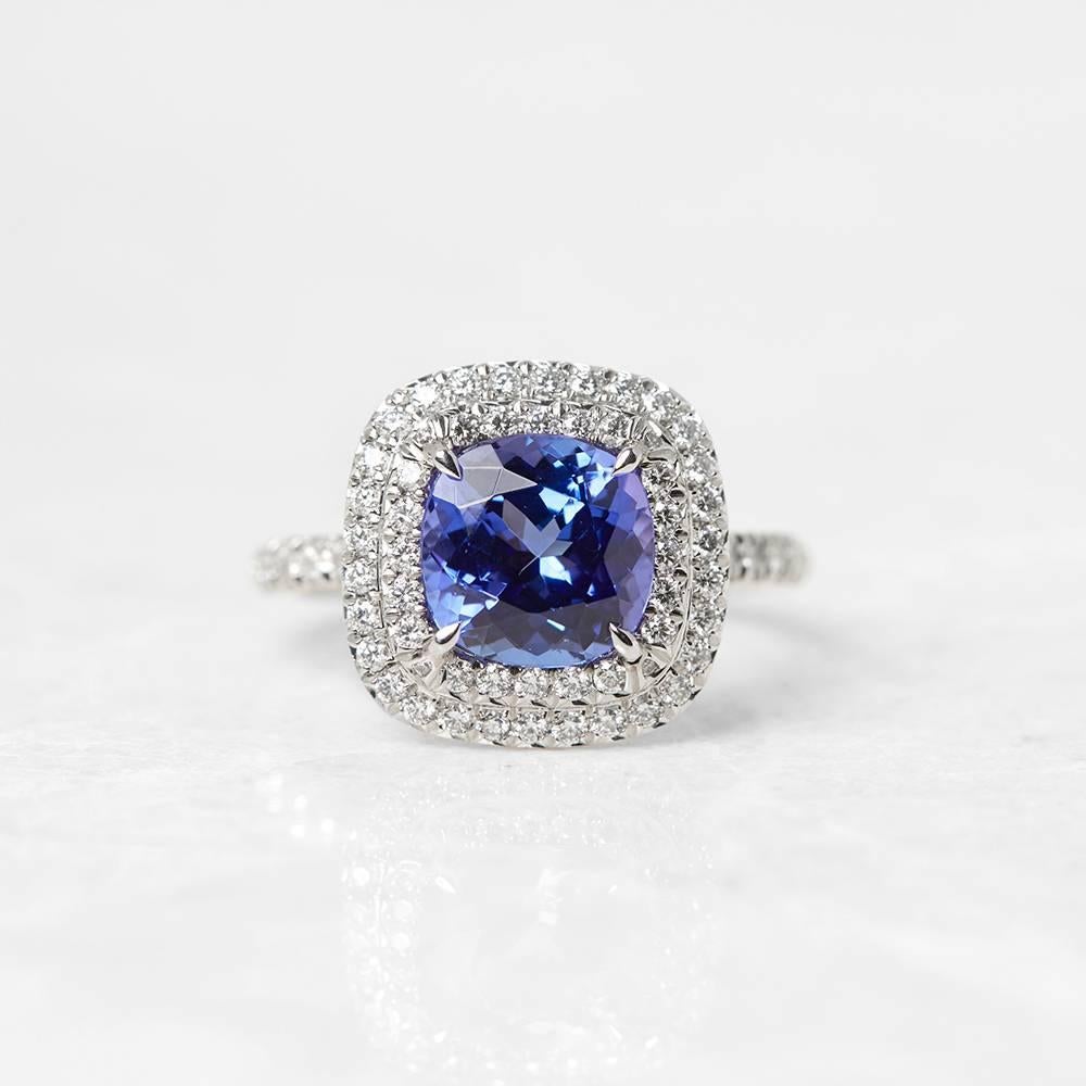 Ref:	COM1129
Age:	2000's
Size:	 L.5, Band Width - 2mm
Box & Papers: Tiffany & Co. Box
Material: 18k White Gold, total weight - 6.46 grams
Gemset: Set with one cushion cut Tanzanite of 2.00ct with 54 round brilliant cut Diamonds of 0.45ct total
