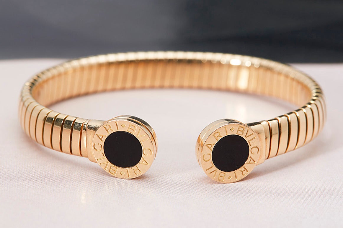Specification 
- 18k Yellow Gold
- Black Onyx inlay

This item has been fully inspected in house. Our experts check all jewellery with the utmost care and attention to detail. We also run a strict history and authenticity check of every item as
