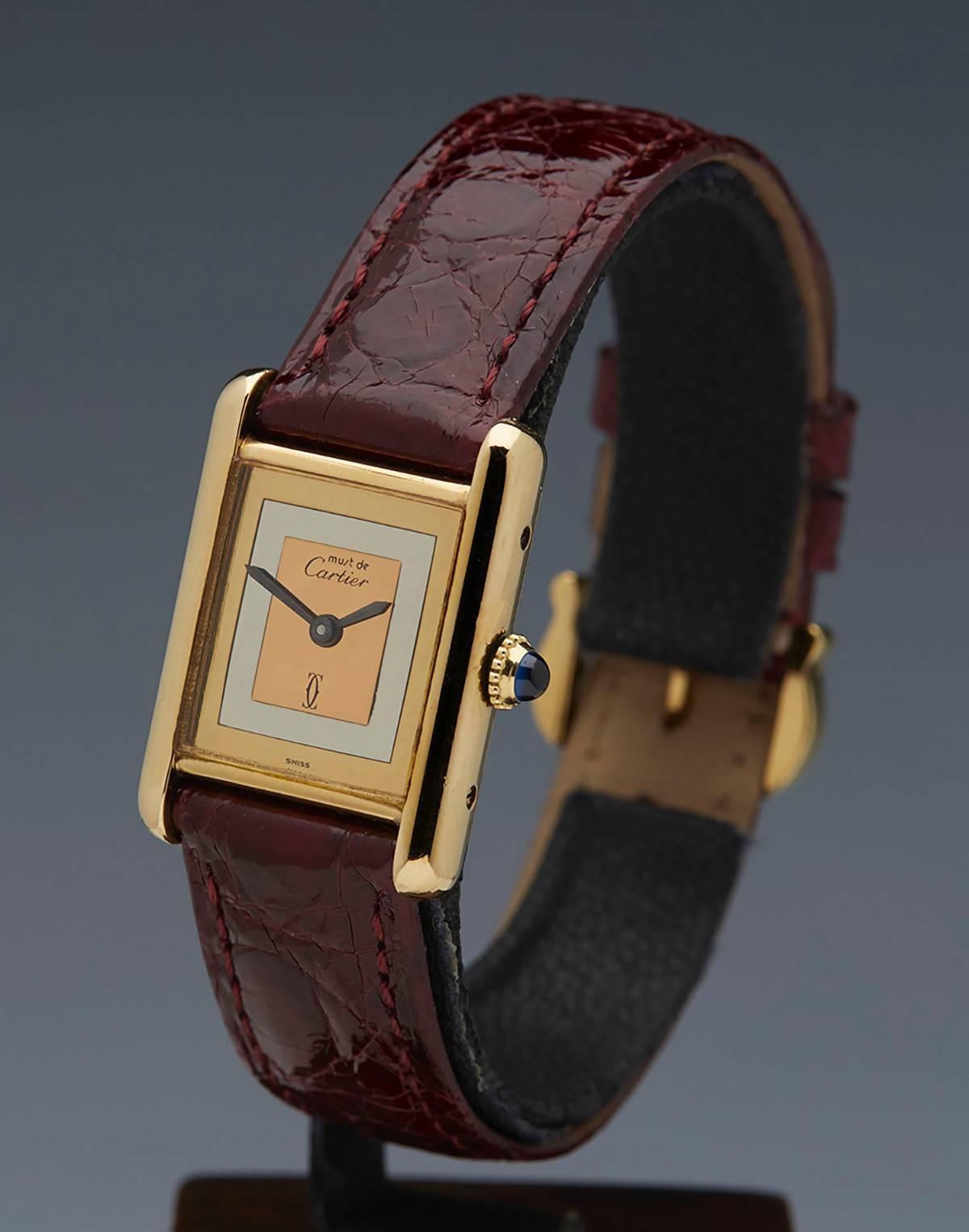 Specifications

Movement: Mechanical Manual Wind
Case: 18k Yellow Gold Plated 925 Silver
Case Diameter: 22mm by 28mm
Dial: Tri Colour Gold Dial
Bracelet: Cartier Burgundy Crocodile Leather
Strap Length: Adjustable
Strap Width: At Case -