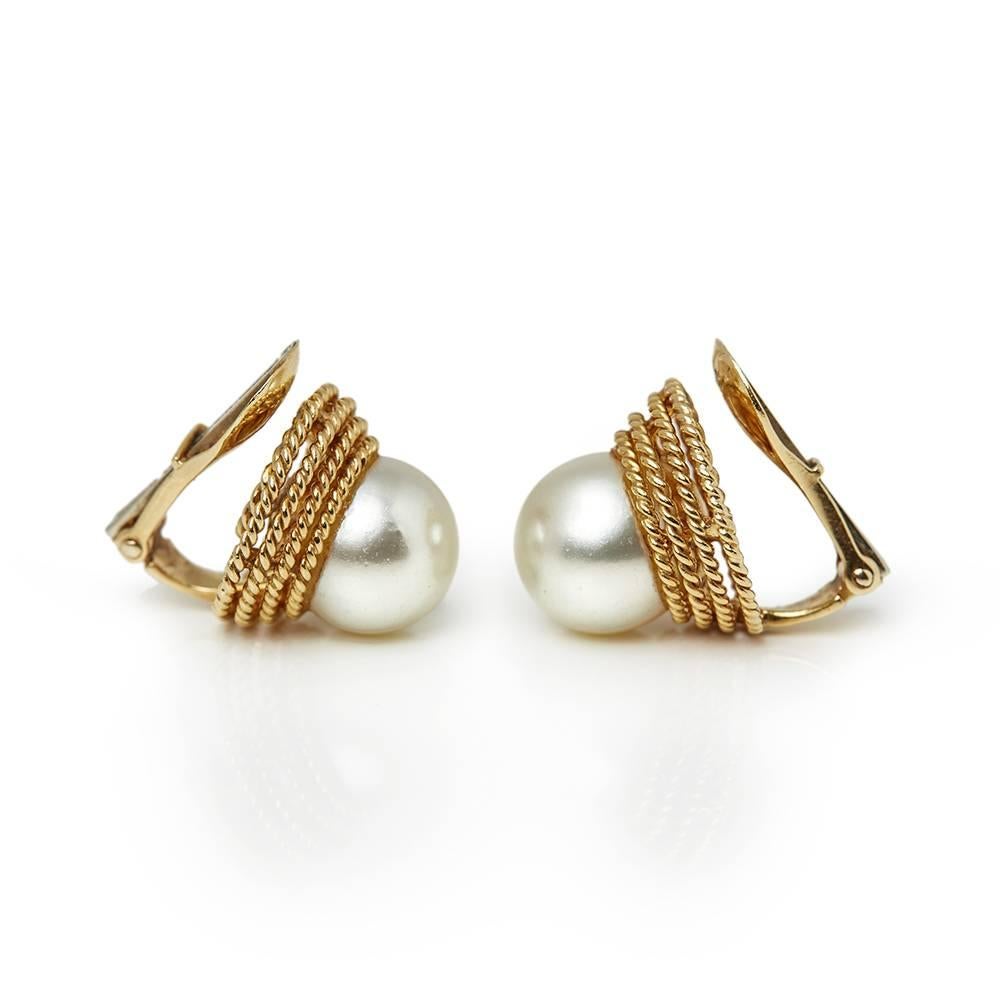 Ref:	COM1313
Size:	 Earring Length - 1.5cm, Earring Width - 1.5cm
Box & Papers: Xupes Presentation Box
Material: 18k Yellow Gold, total weight - 7.94 grams
Gemset: Set with 2 Cultured Pearls measuring 9mm each
Condition: 9 - Excellent