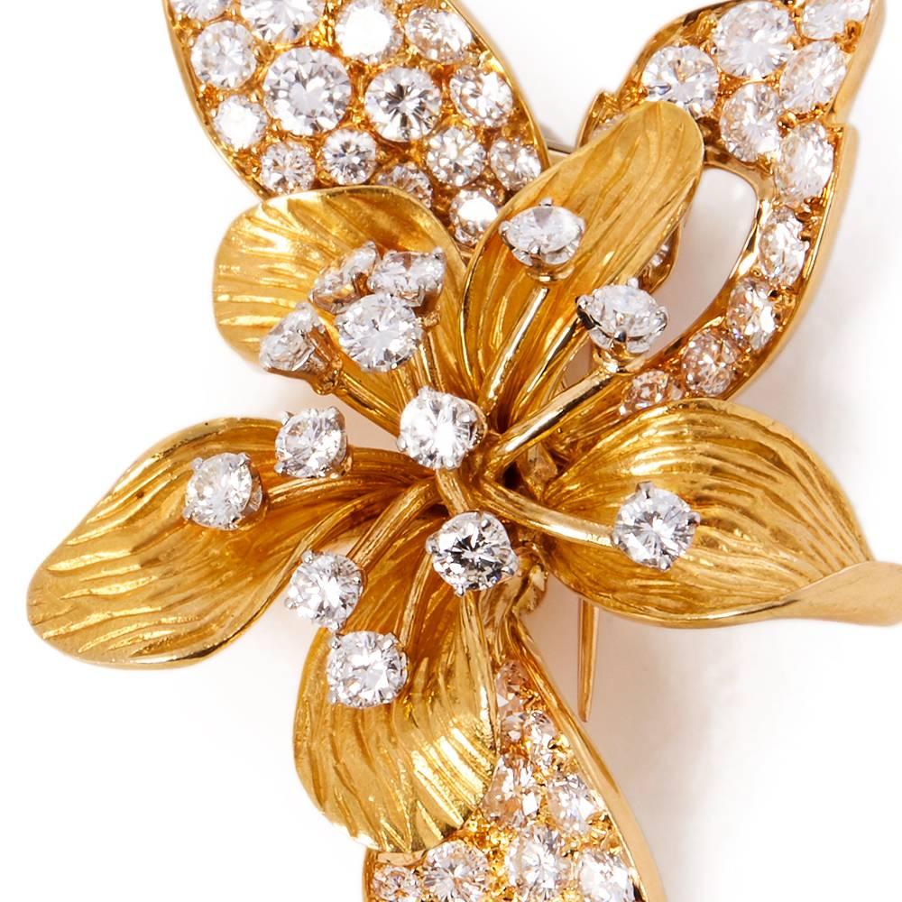 Ref:	COM1464
Age: 1950's
Size: Brooch Length - 5.2cm, Brooch Width - 3cm
Box & Papers: Xupes Presentation Box
Material: 18k Yellow Gold & Platinum, total weight - 15.11 grams
Gemset: Set with 66 round brilliant cut Diamonds of approximately 2.75ct