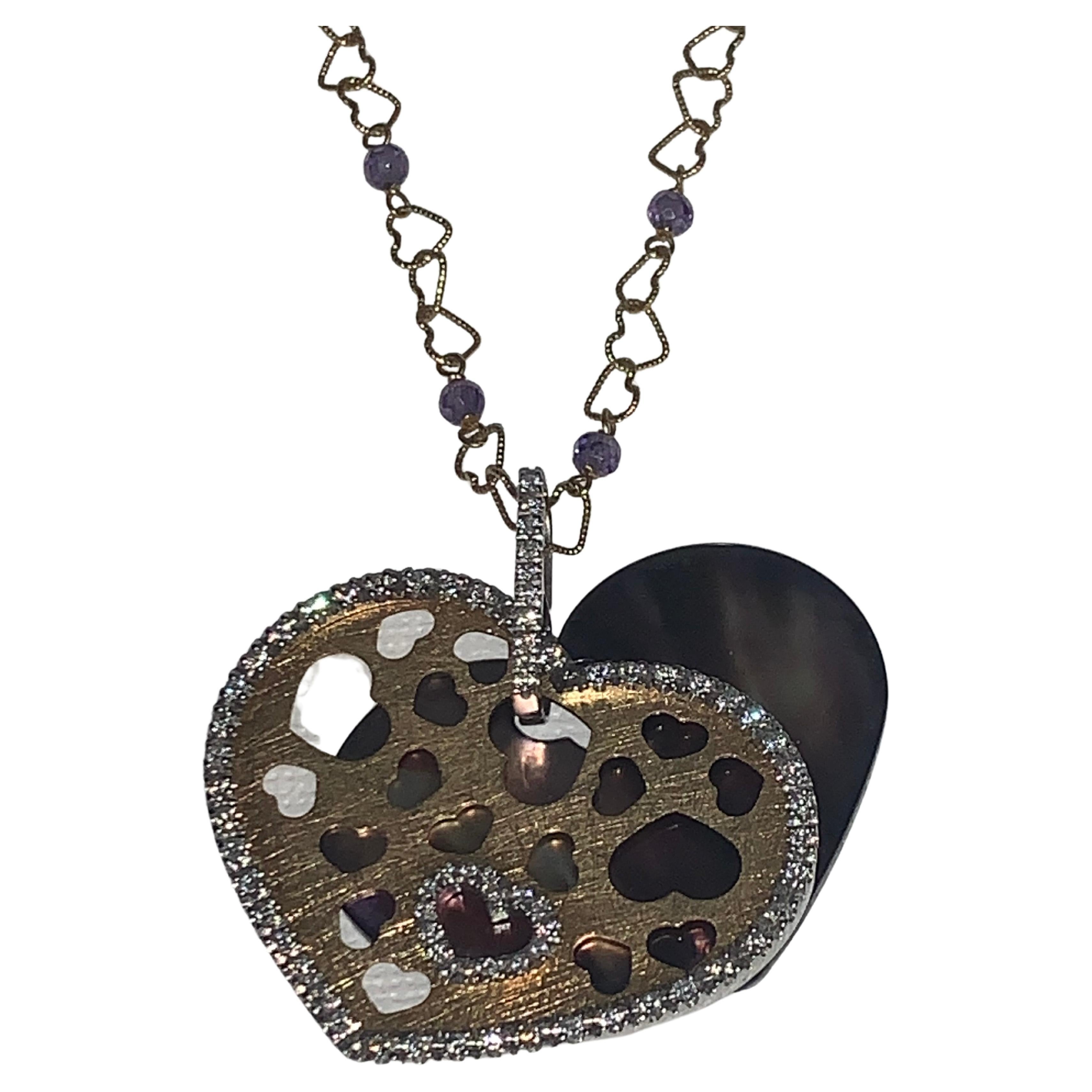 Pavé Diamond, Mother of Pearl, Nanis Heart Necklace.

Featuring a Pavé  Diamonds, Purple Mother of Pearl, Nanis Heart Necklace with a total weight of 0.77 carats, set in 18K Yellow Gold; and 18K Yellow Gold Heart Link & Amethyst chain, Size 18