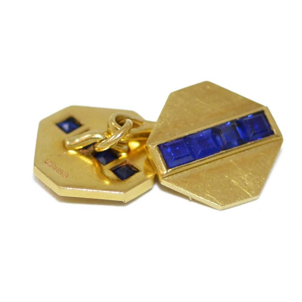 A 14ct yellow gold and square cut sapphire dress set. Signed Cartier, numbered 3928. American, circa 1940.