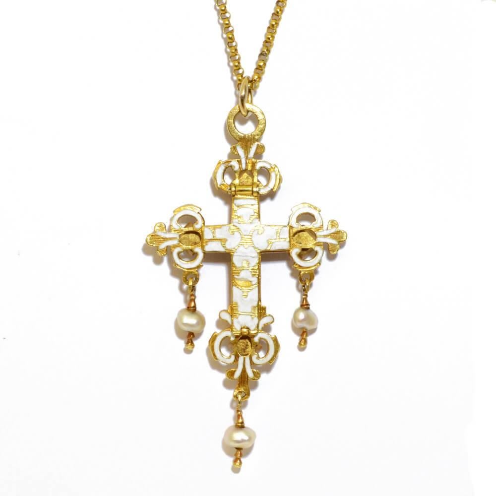 A late 17th century green glass and enamelled cross set with three natural oriental pearl drops. Mounted in gold. Enamelled in white on reverse. Spanish, circa 1680.