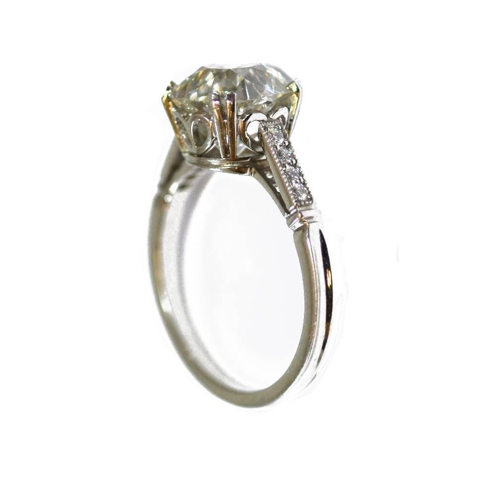 An old cushion cut diamond ring weighing, the stone, circa 1910 weighs 3.34ct, I VS2, in a hand made contemporary platinum mount.