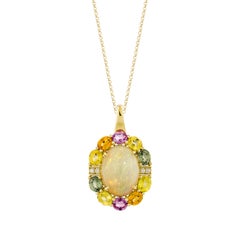 Colgante de Sunita Nahata con ópalo de 7,14 ct y zafiros variados en oro amarillo de 18 quilates con diamantes.