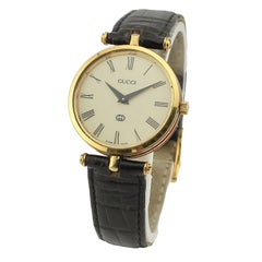 Reloj Gucci 2000M vintage chapado en oro, esfera romana color crema, hebilla original, 30 mm, G55