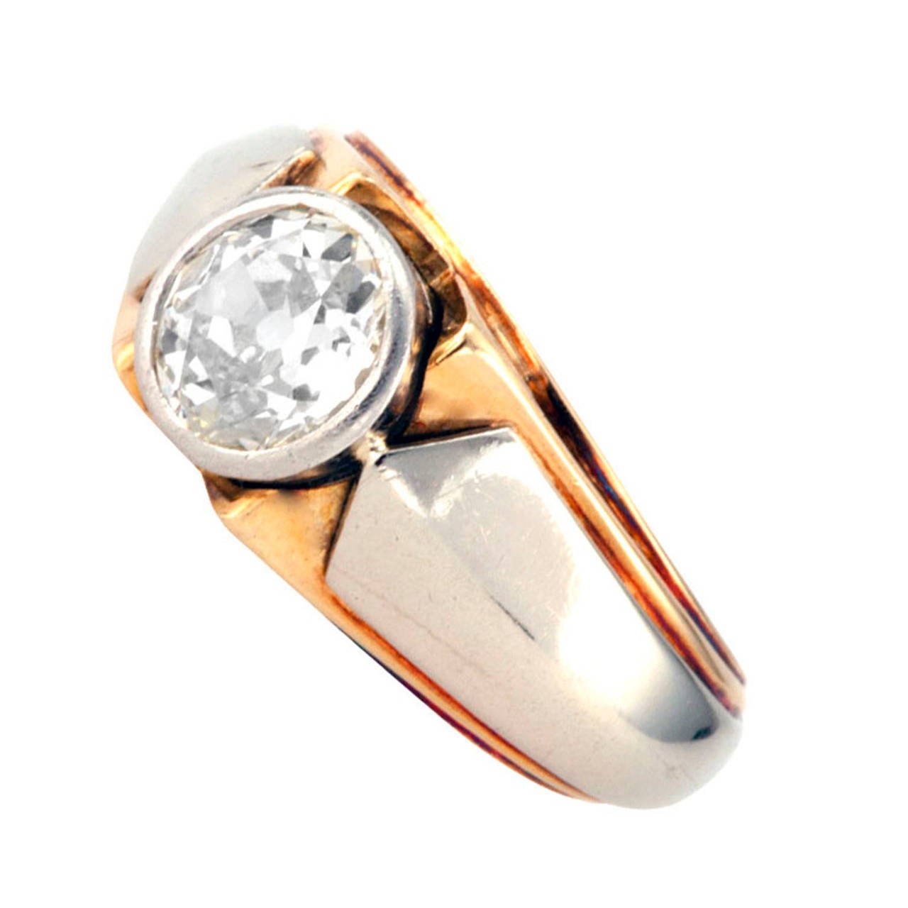 1.10 Carat Art Deco Diamond Ring                                                        

From the 1930's,  discrete and elegant in a two-tone mount featuring a bezel-set old European-cut diamond weighing approximately 1.20 carat, approximately K