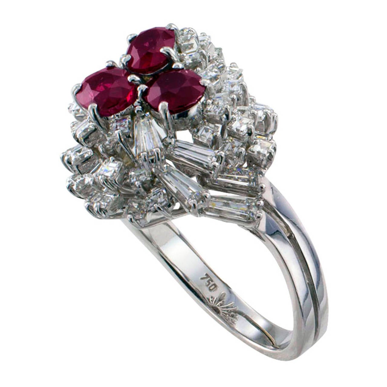 Ruby and Diamond Cocktail Ring
A most intriguing and unique design shaped as a spiraling swirl composed by fifty-nine square-cut and tapered baguette cut diamonds totaling approximately 2.50 carats (approximately VS clarity, G-H color), topped by a