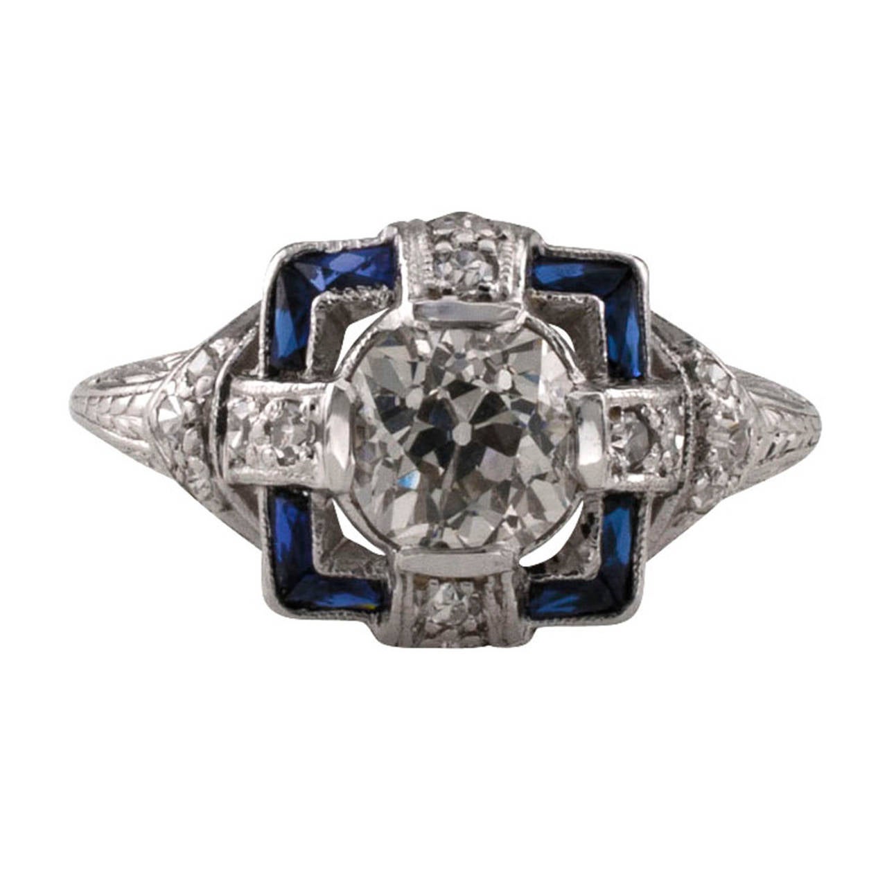 Circa 1925, this lovely Art Deco engagement ring centers upon an old European-cut diamond weighing 0.92 carat, accompanied by a report from EGL-USA stating that the diamond is H color and SI1 clarity, surmounted on a rectangular motif set with