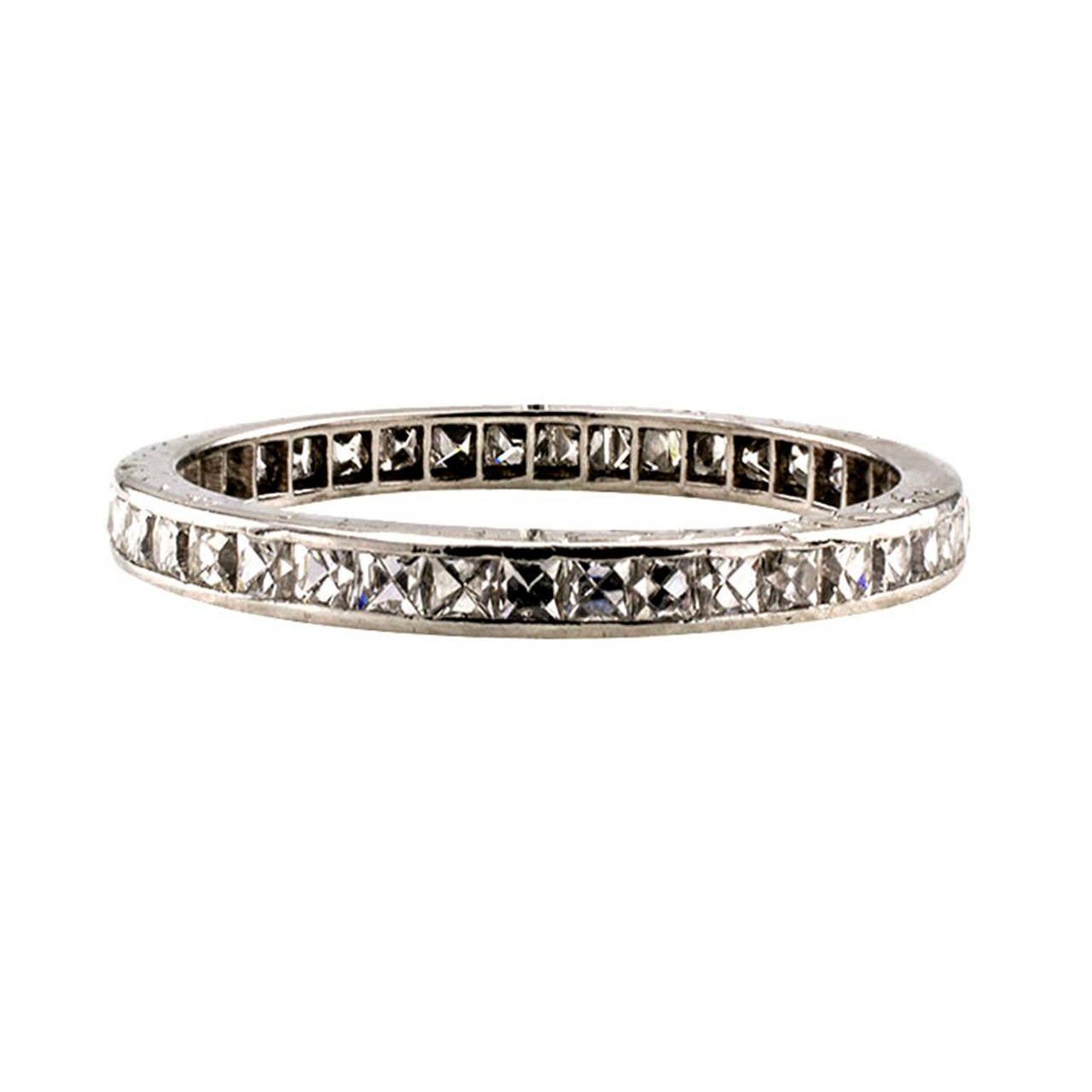 Art Deco French-Cut Diamond Platinum Eternity Ring

Circa 1920.  This is a special find, continuously set with thirty-nine French-cut diamonds totaling approximately 1.00 carat, approximately G color and VS clarity, mounted in platinum, 2 mm wide,