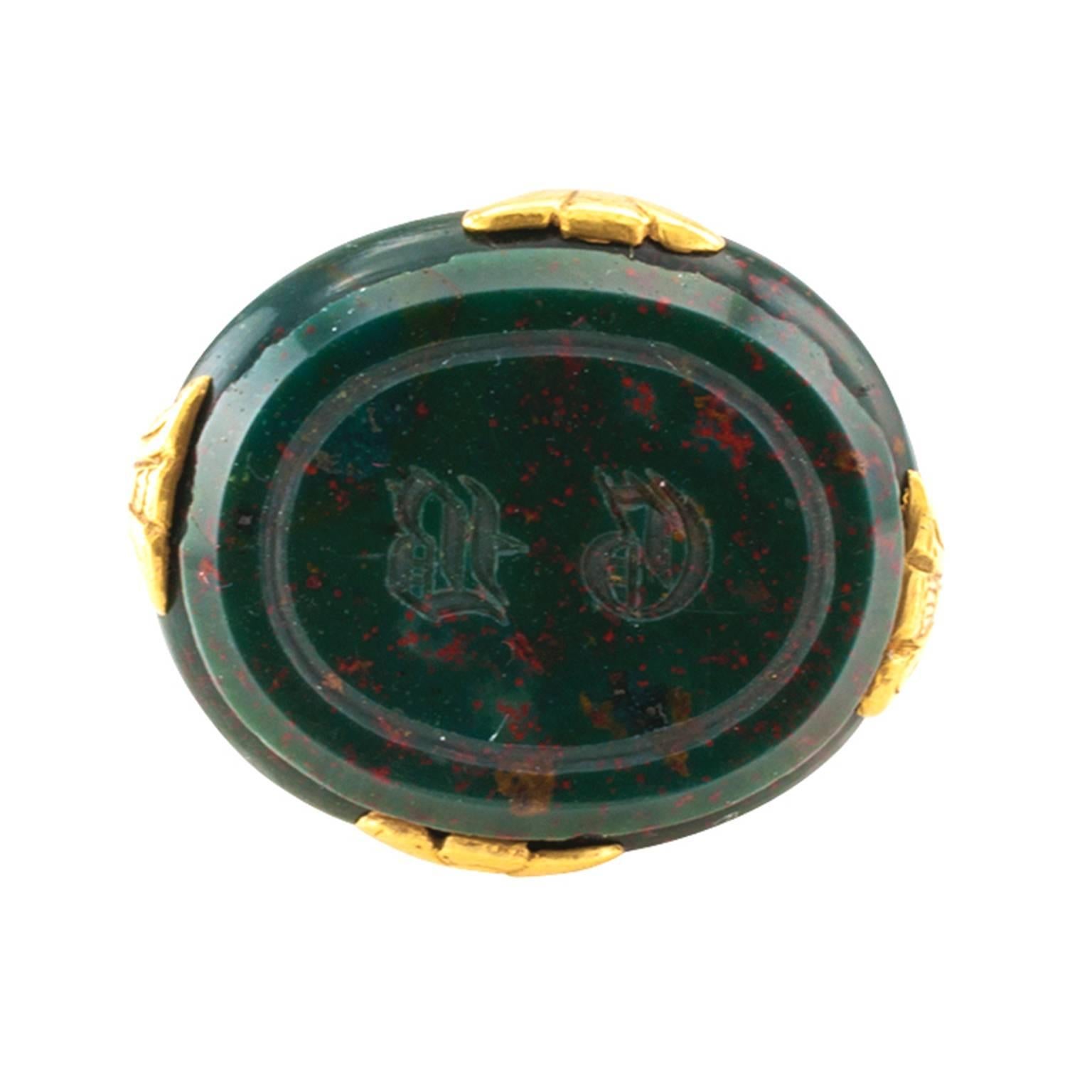 French Victorian Gold and Bloodstone Fob

For sure very nice by itself or as a very fine piece to add to an already existing collection.  This fob is a marvel of design and structure.  Set with a very fine bloodstone, mounted in 18 karat yellow
