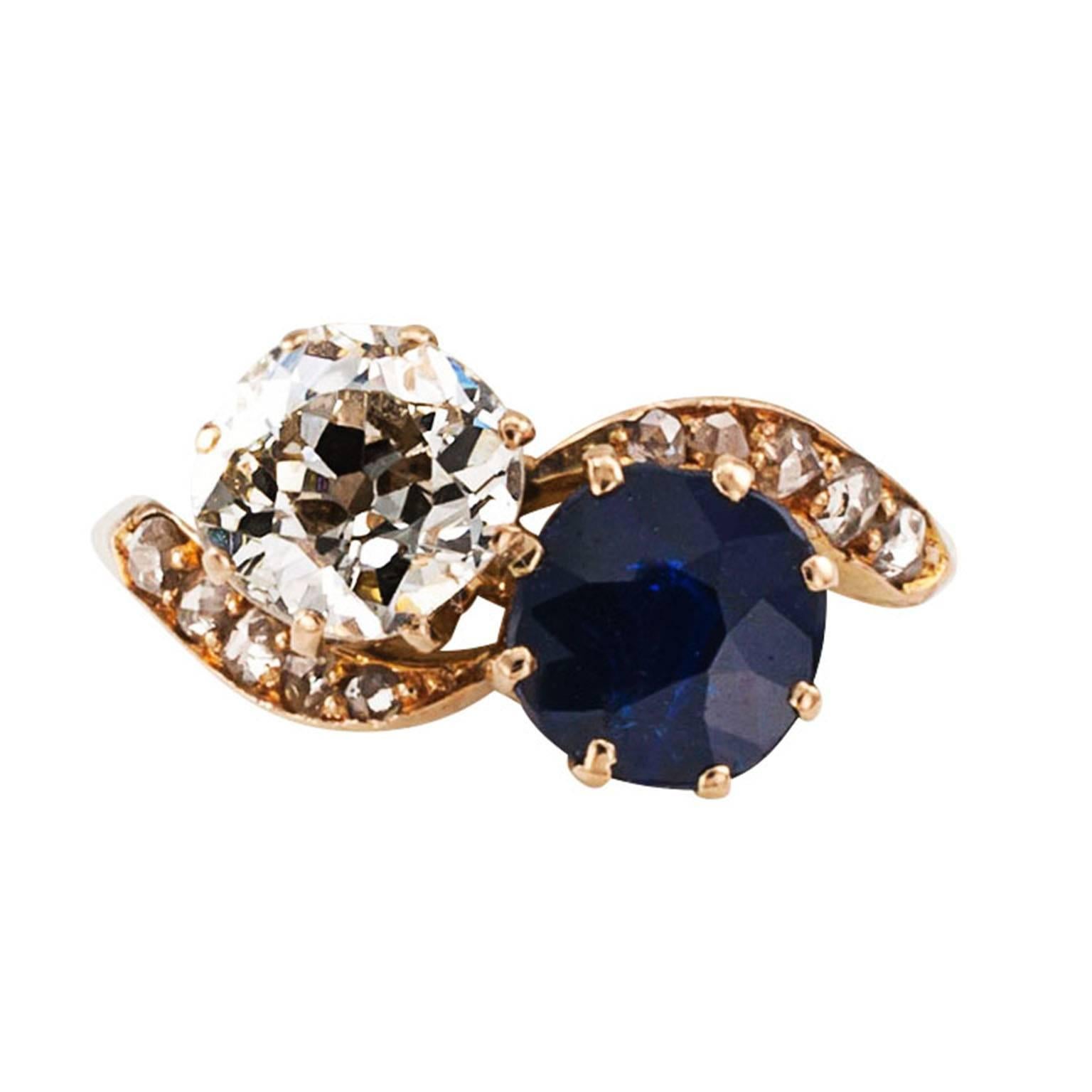 Victorian Diamond and Sapphire Toi et Moi Ring

Togetherness, the you and I of romantic relationships gracefully expressed in this artful Victorian ring featuring a blue sapphire weighing approximately 1.25 carats, seemingly entwined with an old