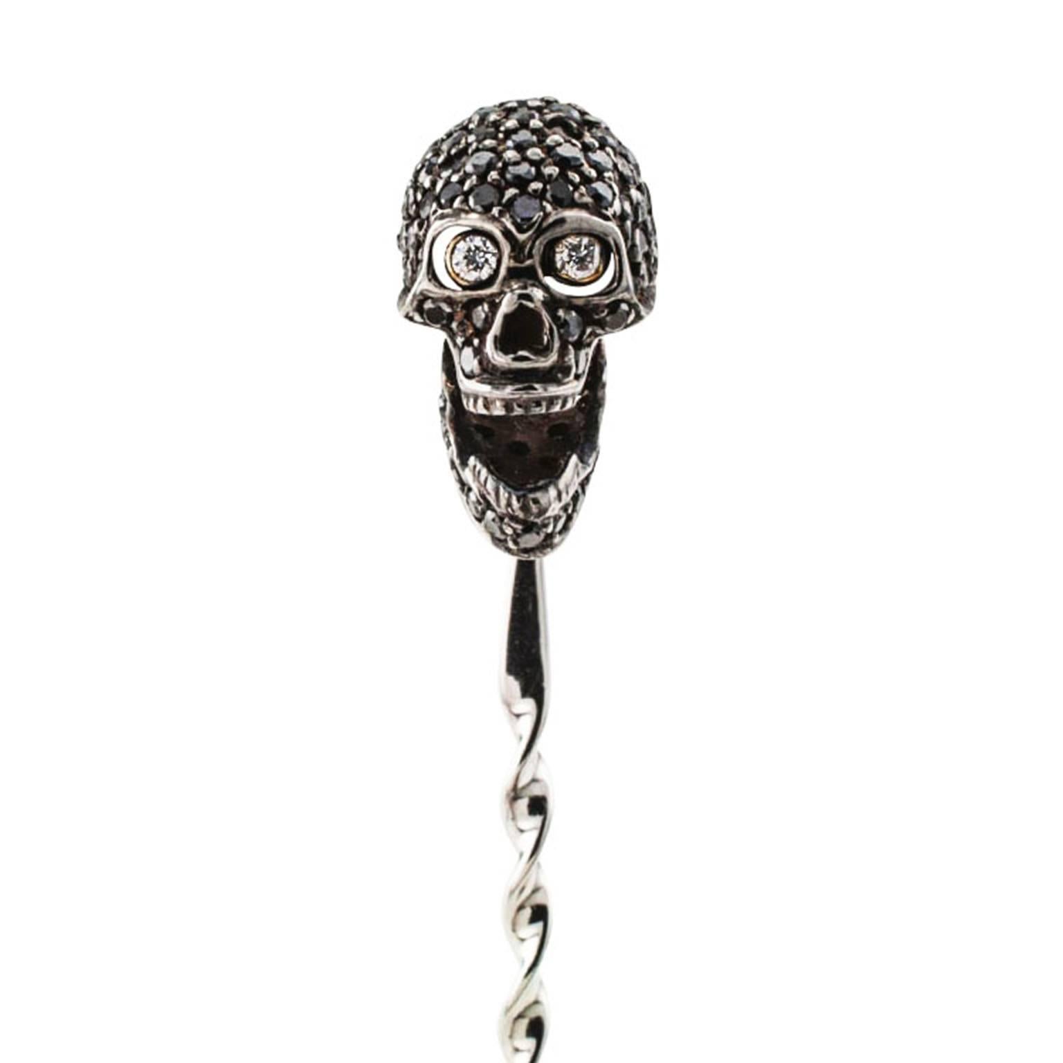 Black Diamond Skull Stick Pin

A macabre and whimsical conversation piece... icebreaker.  The yellow gold bezel-set white diamond eyes pop when the articulated jaw is open and they literally disappear when the jaw is closed.  Have fun.  18 karat