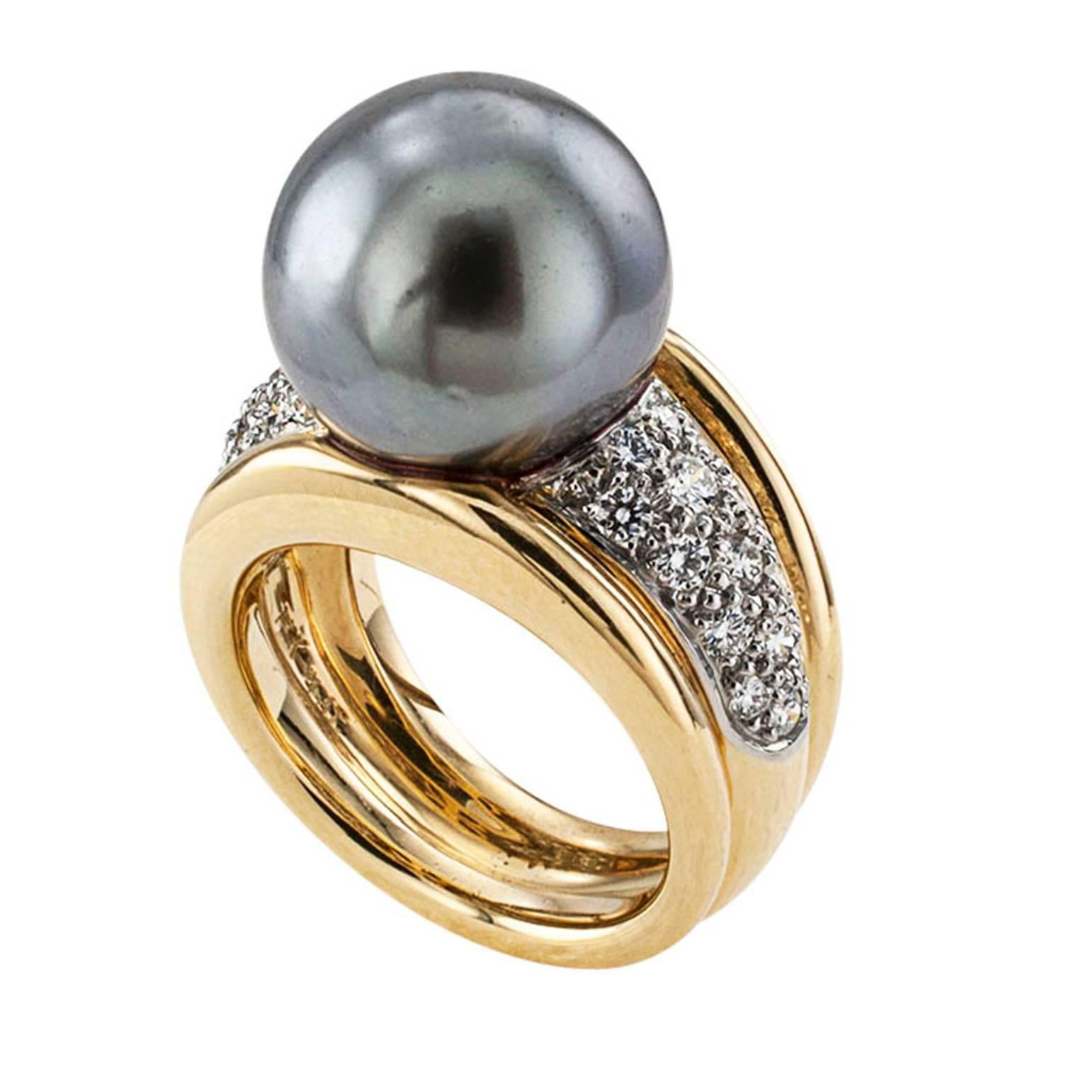 Tahitian Cultured Pearl and Diamond Cocktail Ring

Twenty-eight radiant diamonds set the stage to glamorize the luscious 13 mm Tahitian cultured pearl that dominates this exotic and sensuous ring crafted in 18 karat yellow gold and platinum.  The