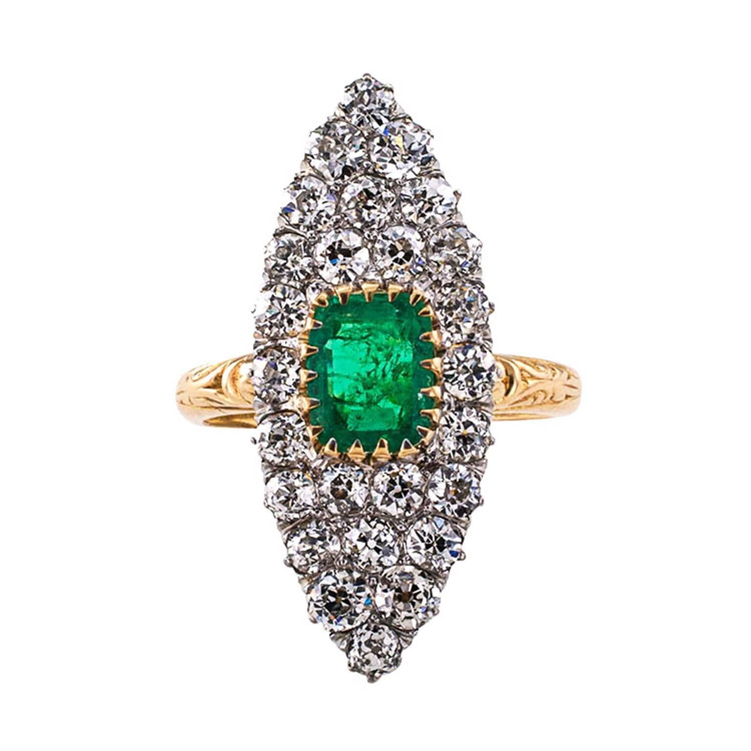 Edwardian Emerald and Diamond Ring

So much exhilaration and happiness contained in the simple navette shaped design as old diamonds shimmer and cuddle tightly around the old emerald cut Emerald displaying its beautiful color as it rests within