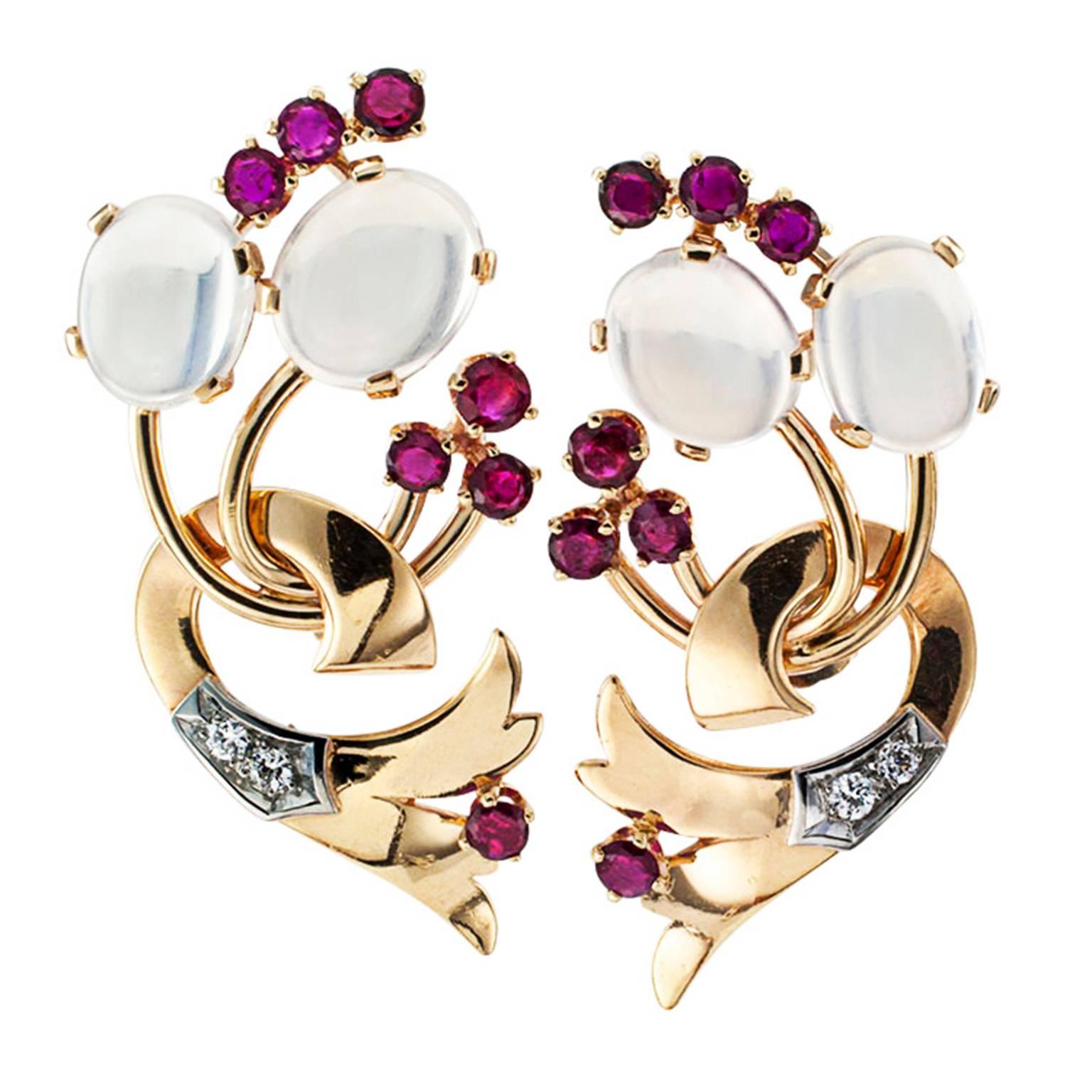 Moonstone Ruby Diamond Gold Retro Earrings

Unique and fanciful, in its day retro jewelry was avant garde, and it has remained so to this day; such boldness in design has never been more inventive or feminine.  These clever, left and right,