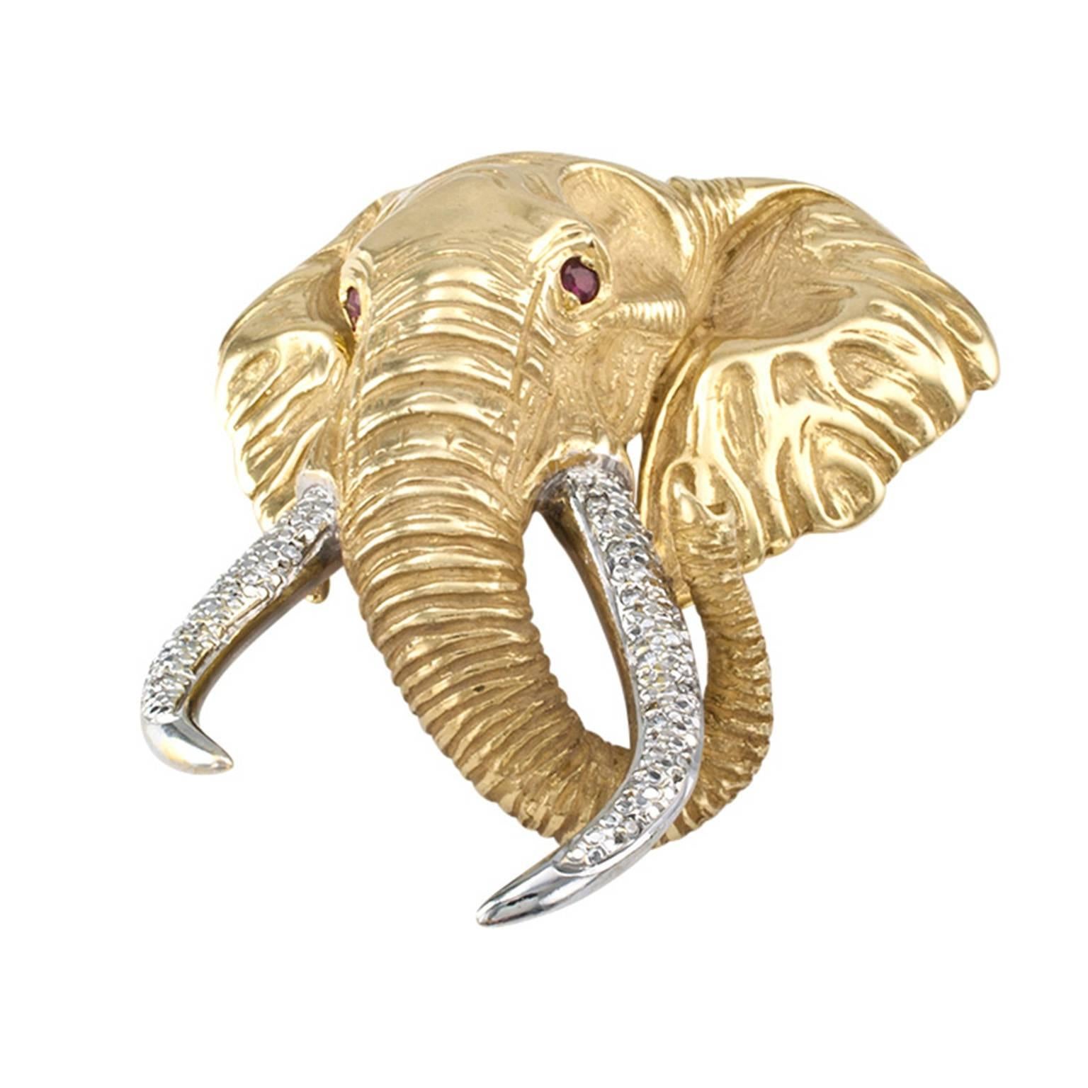 Estate Elephant Large Brooch Pendant

Look no further if you love elephants, and who doesn't?  Wear it as a pin or as a pendant and be prepared to rake in the compliments.  A jewel as magnificent as the jungle beast it represents, crated in 14