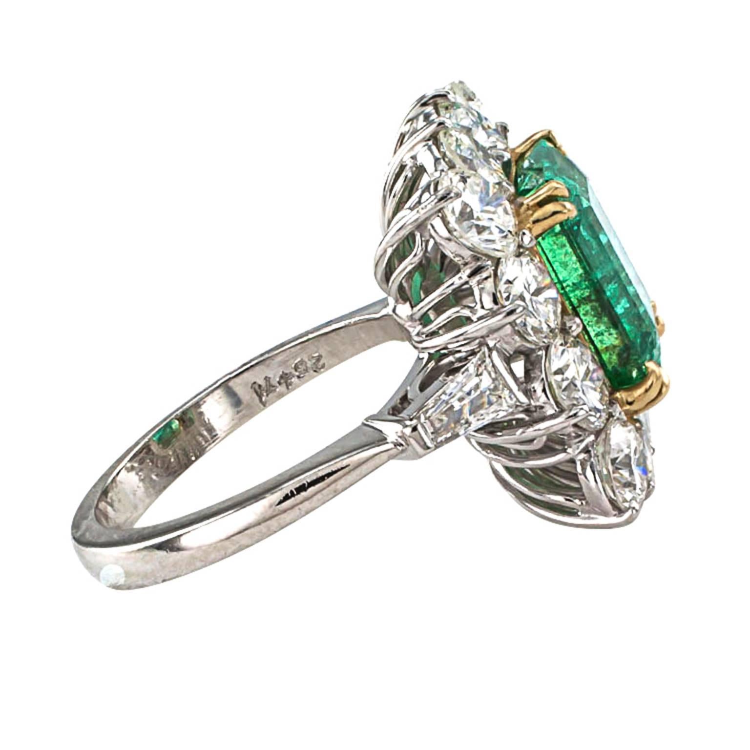 Emerald and Diamond Cocktail Ring Circa 1950

What can be said about this emerald and diamond ring that isn't perfectly obvious by just looking at it. It is a show piece all on its own.  An important platinum and 18 karat yellow gold jewel