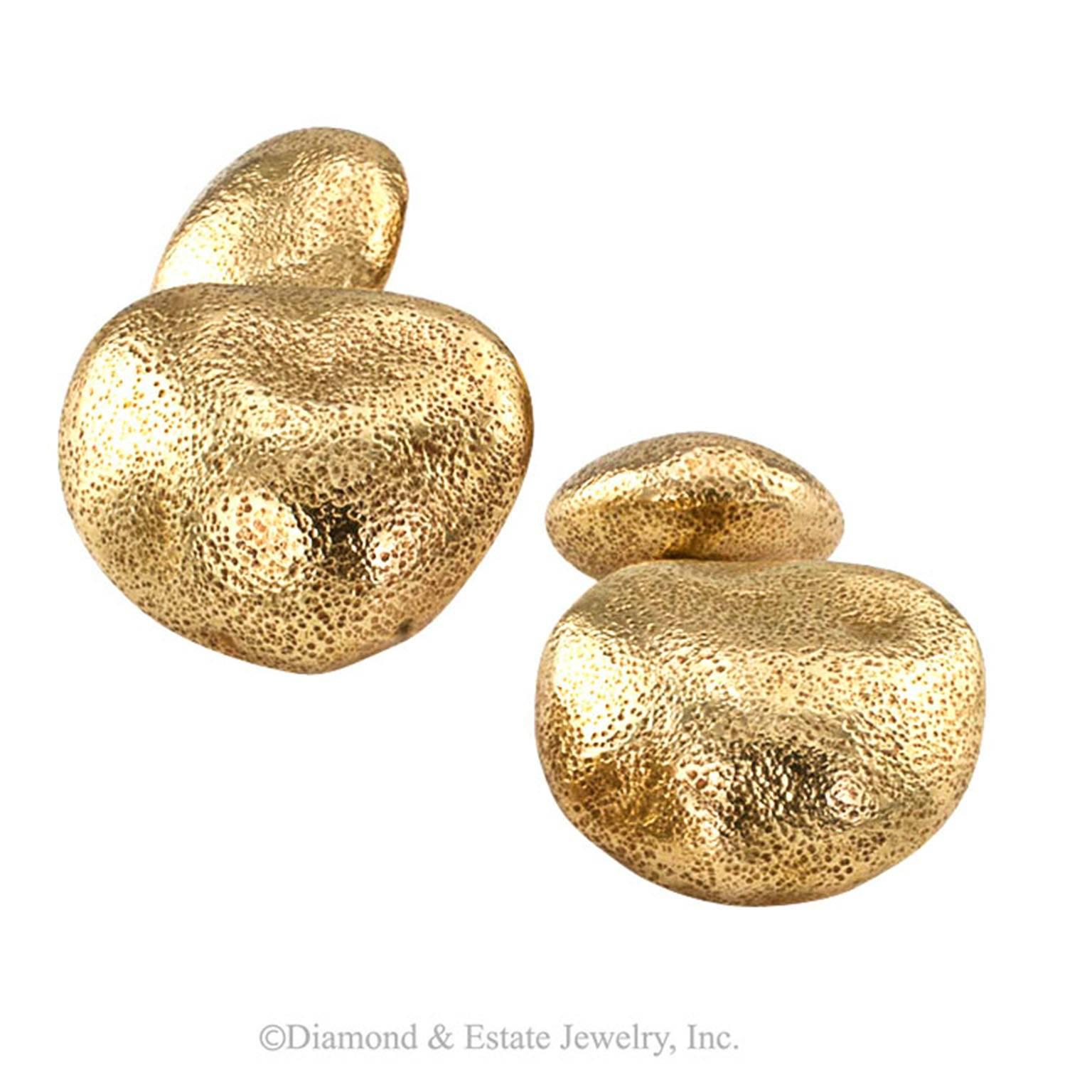 1960s Tiffany and Company Estate Gold Pebble Cufflinks 
Handsome and most unusual, perceived by some as gold nuggets; by others as gold pebbles.  Really nice pebbles at that!  Crafted in 18 karat yellow gold, Signed Tiffany.  Estate Tiffany and