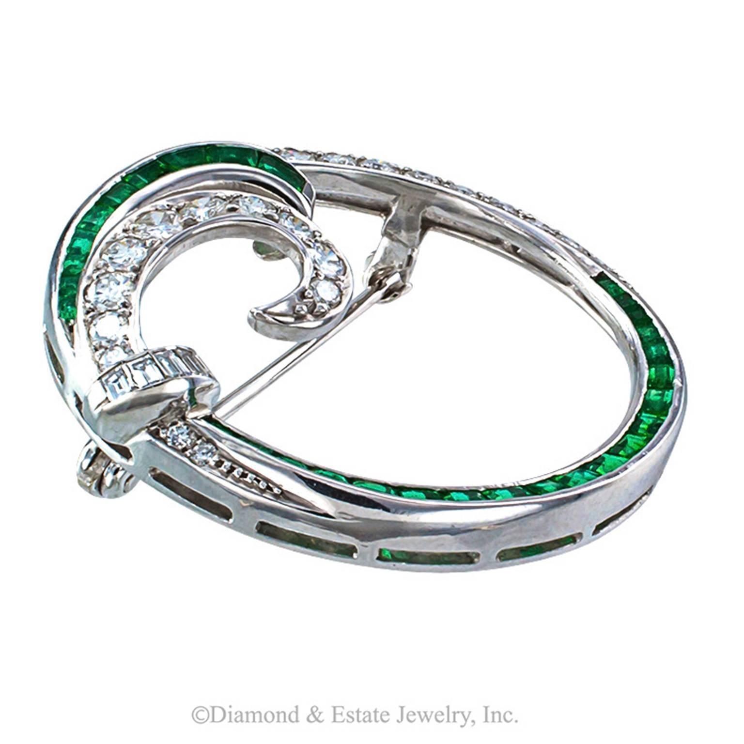 Emerald and Diamond Platinum Circle Brooch Circa 1950

Circular brooches score the highest marks in terms of classic and distinctive jewelry.  This mid-century beauty is no exception, mounted in platinum with gorgeous calibrated emeralds and