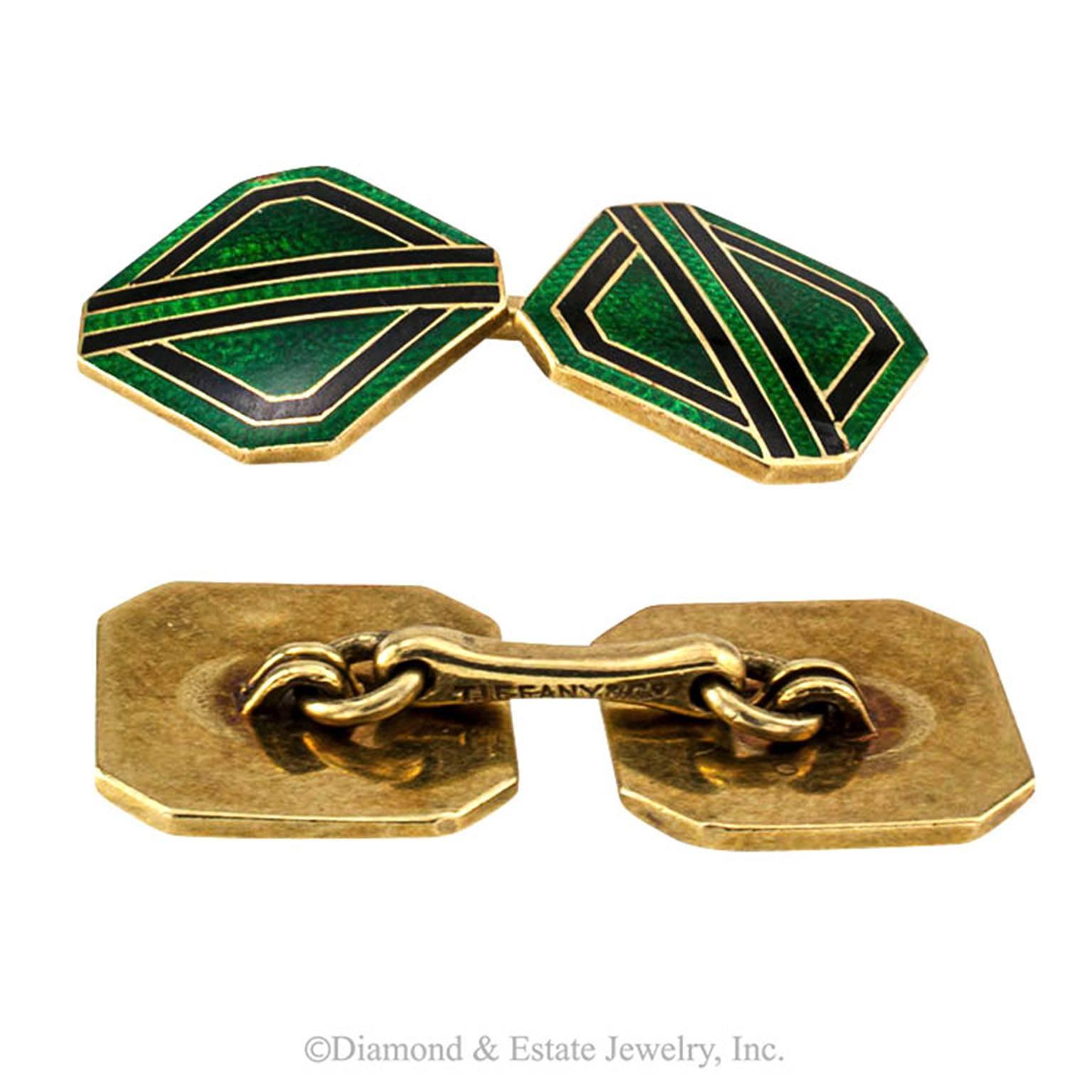 Tiffany and Co. Estate Green and Black Enamel Cufflinks Circa 1930

It is inevitable to overlook the racing-stripe theme that runs through this sporty pair of cuff links... subtle and masculine...at the ready for action and adventure, but always