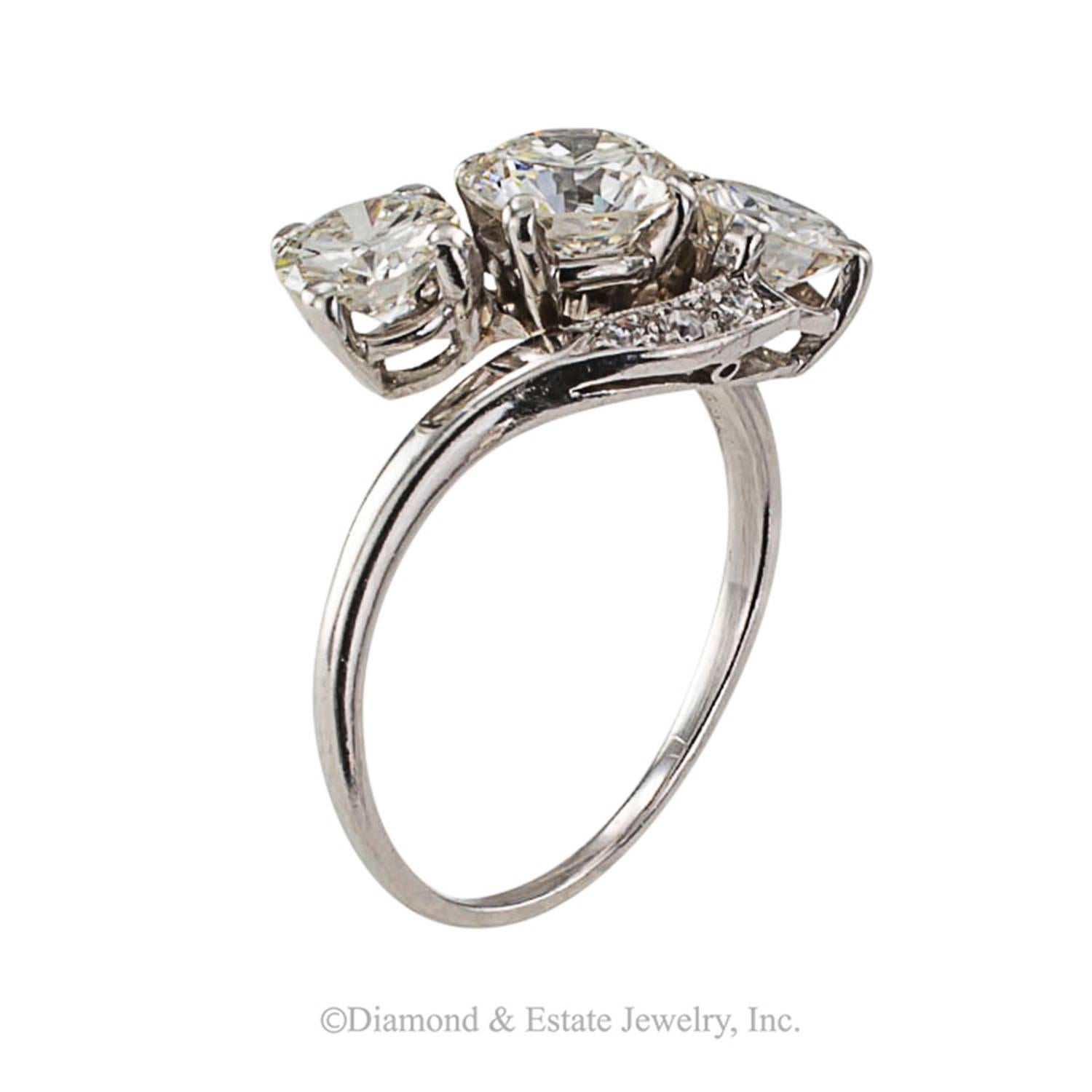 Mid Century Three Stone Diamond Ring

During the 1950s, jewelry design took a unique turn.  In general people felt prosperous and they wanted tasteful, but diamond intensive jewelry pieces, preferably mounted in platinum or white gold.  The