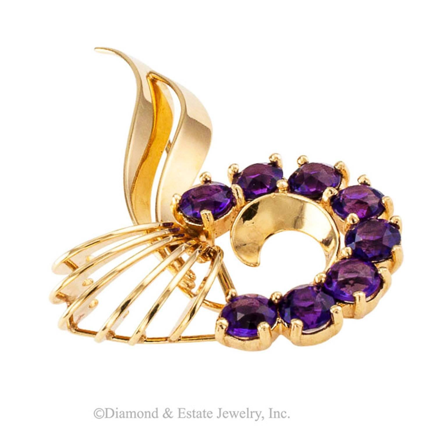 Krementz Amethyst and Gold Retro Brooch/Pendant

In all of its simplicity, contemplate how beautiful this pin is.  It has so much movement.  All of it so graceful.  It is a burst of joy!   The design is so well thought out.  The amethyst... such