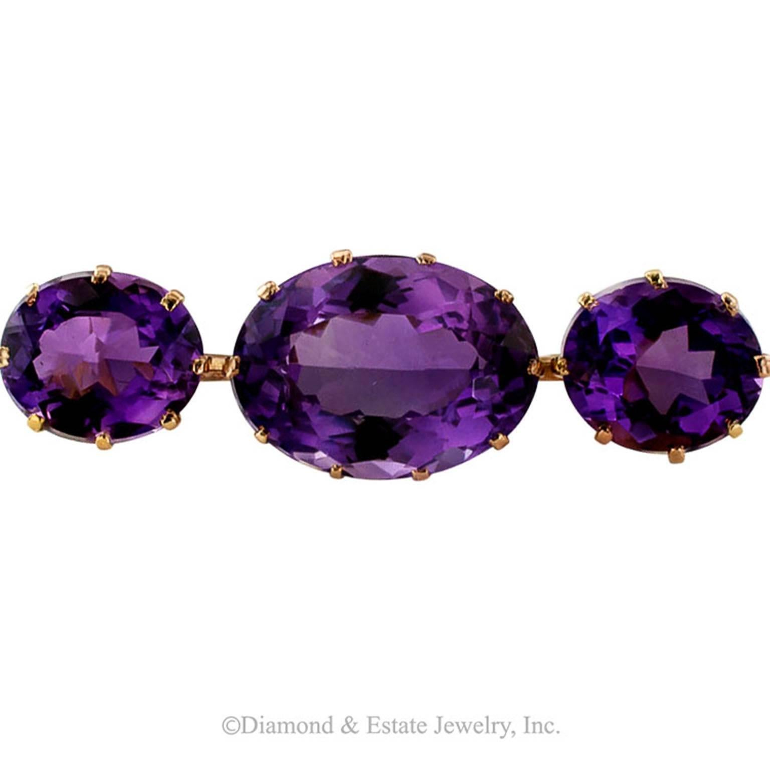 Victorian Larger Amethyst Bar Brooch

Royal purple amethyst and that is all that there is to it!  A good size brooch formed by the linear arrangement of a trio of well matched stones that total approximately 34.00 carats, mounted in 18 karat gold.