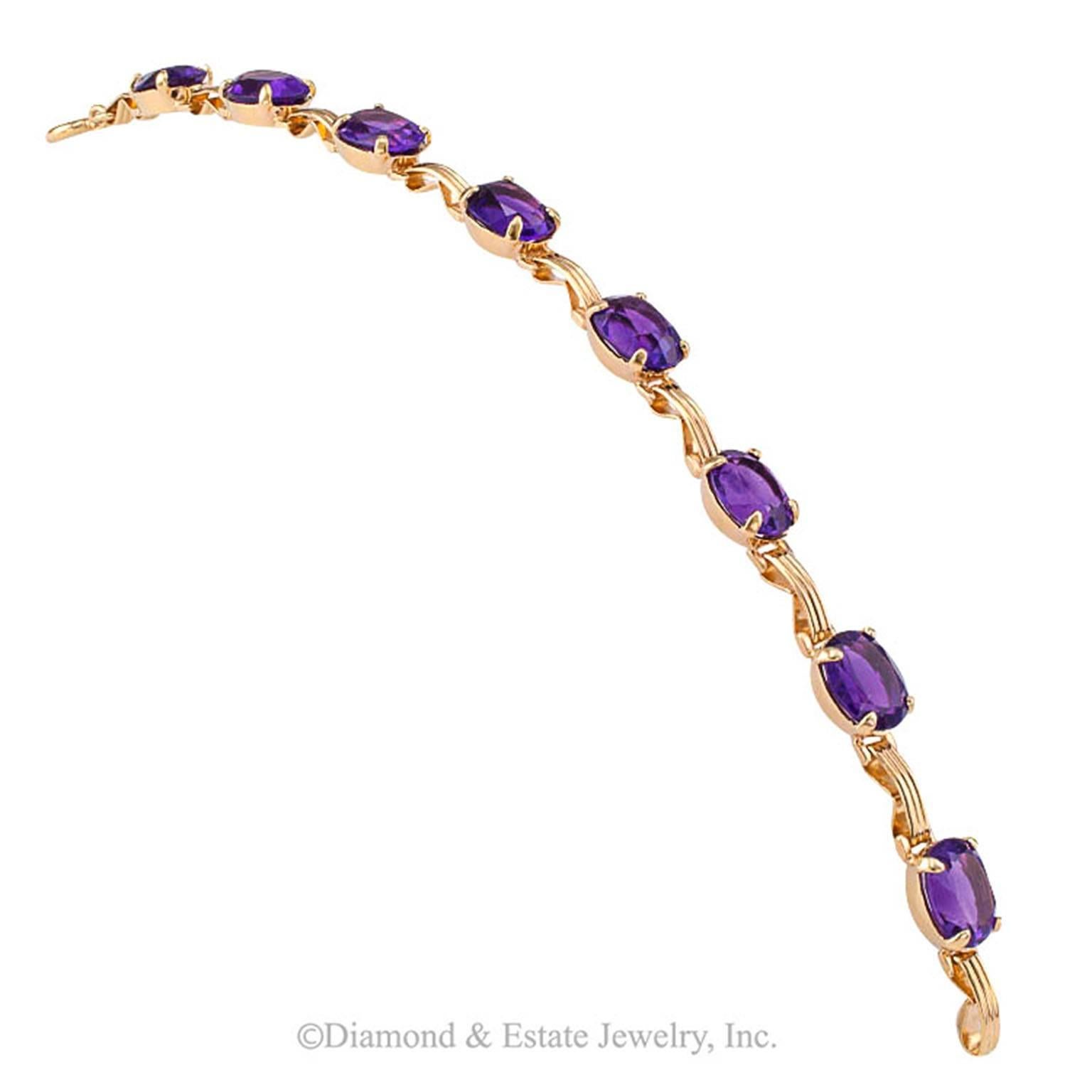 Mid-Century Amethyst and Gold Line Bracelet

Eight very pretty, well matched, bright and color saturated oval amethyst totaling approximately 20.00 carats aligned to form this simple, but extremely attractive 14-karat gold line bracelet, 1950's