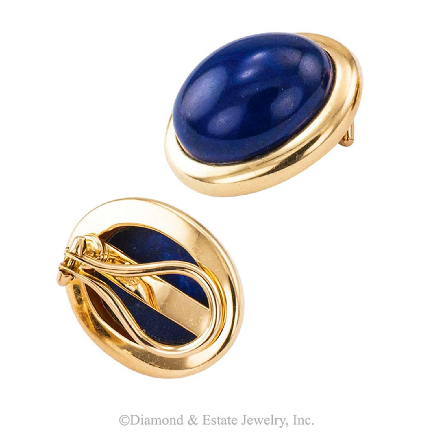 1970's Lapis Lazuli and Gold Button Ear Clips

Smart and practical lapis lazuli button ear clips.   A design that never goes out of style.  A beautiful cabochon set in a simple 14-karat yellow gold bezel. The color of fine lapis lazuli is a