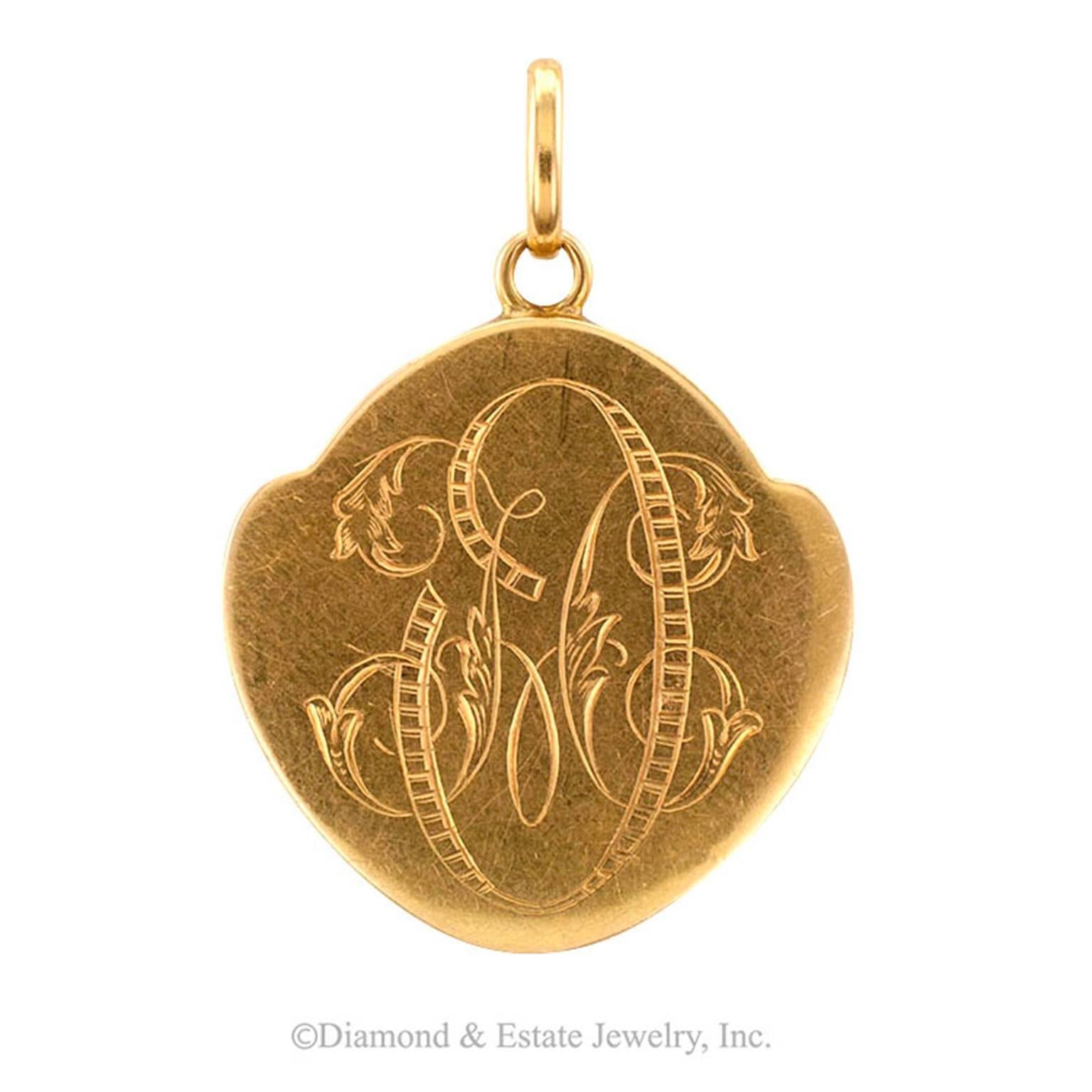 Art Nouveau Gold and Diamond In Relief Locket

At the turn of the century, images of the ideal woman were the antithesis of their Victorian counterparts.  She was more liberated, more progressive in every sense of the word.  The lovely in relief