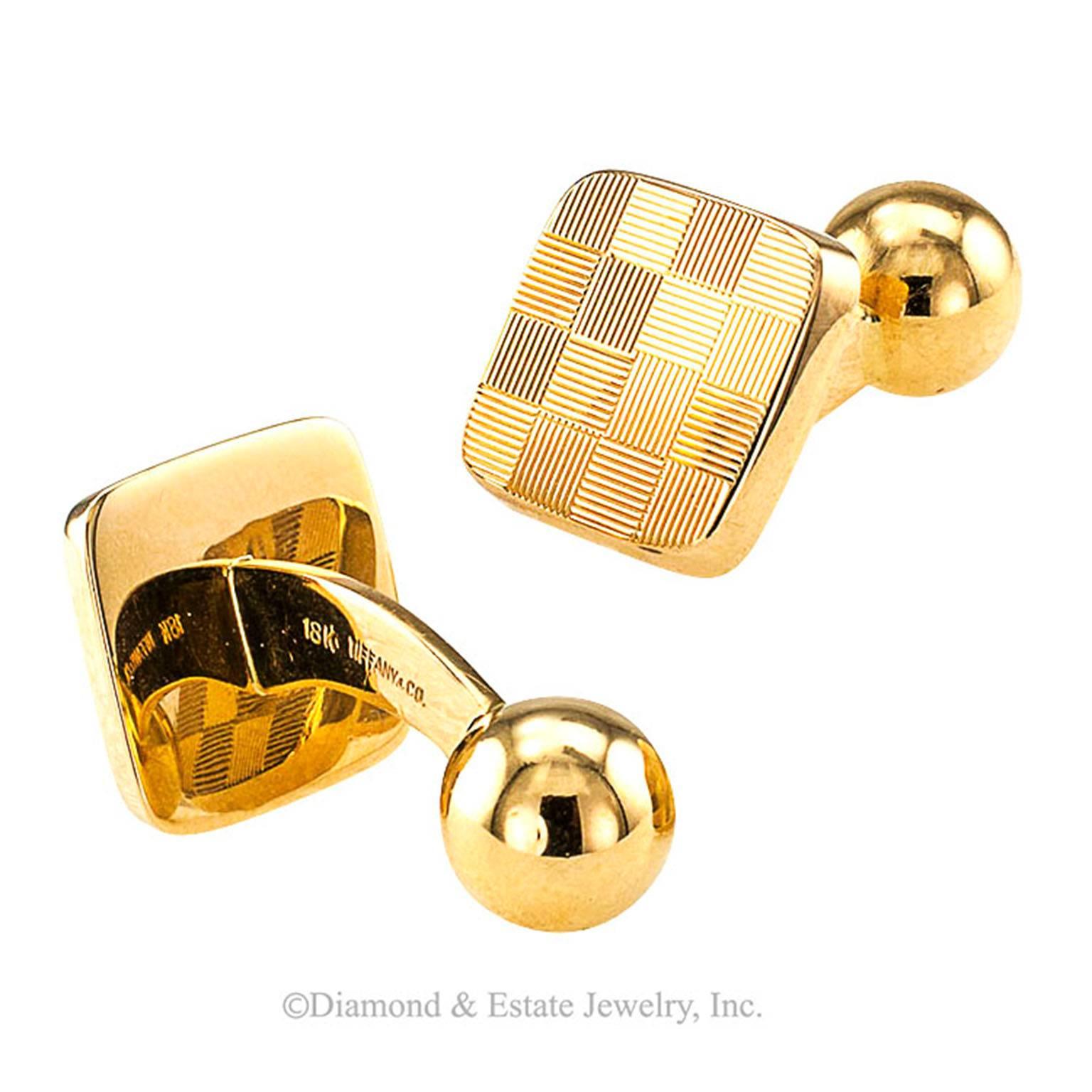 Tiffany & Co. 18-Karat Gold Checkerboard Cufflinks

Checkerboard pattern Tiffany & Co. 18-karat gold cufflinks, circa 1970. Tiffany does it just right every time.  Their styling is always impeccable as illustrated by this outstanding pair of