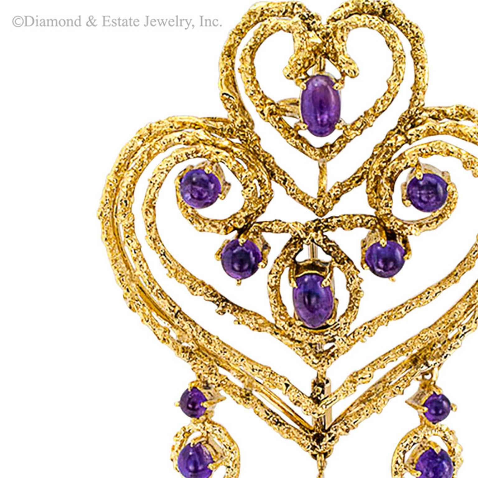 Spritzer & Furman Amethyst and Gold Heart-Shaped Brooch/Pendant

A Spritzer & Furman 18-karat textured gold larger scale design, a contemporary abstraction of five graduating and superimposed open work heart-shaped motifs adorned with cabochon