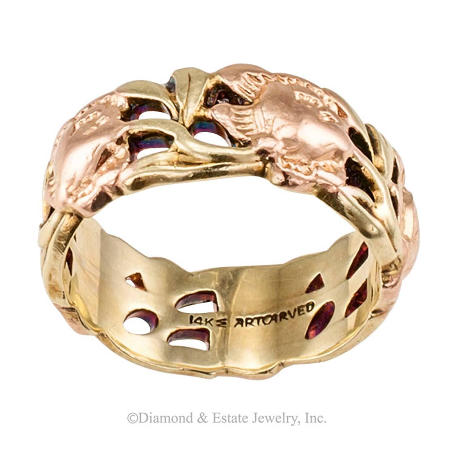 1940s Rose Green Gold Eternity Wedding Band

1940s rose and green gold foliar motif wedding band.  The open work retro design features a continuous arrangement of rose gold roses interlaced with green gold foliage.  All of it dressed in a