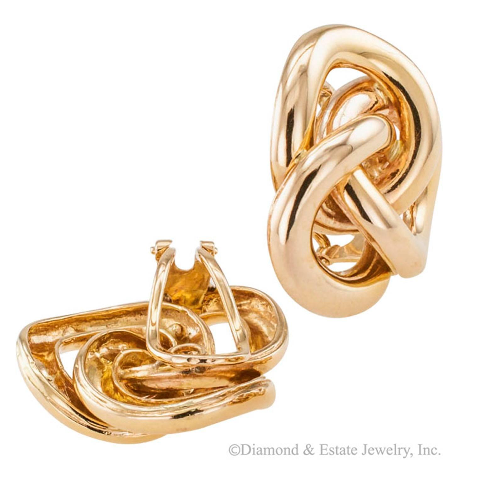 1960s Gold Knot Ear Clips

     Larger size gold knot ear clips circa 1960.  The classic knot design in this 14-karat yellow gold larger representation looks just as smart and sensible as can be, and the omega clips makes them very comfortable on