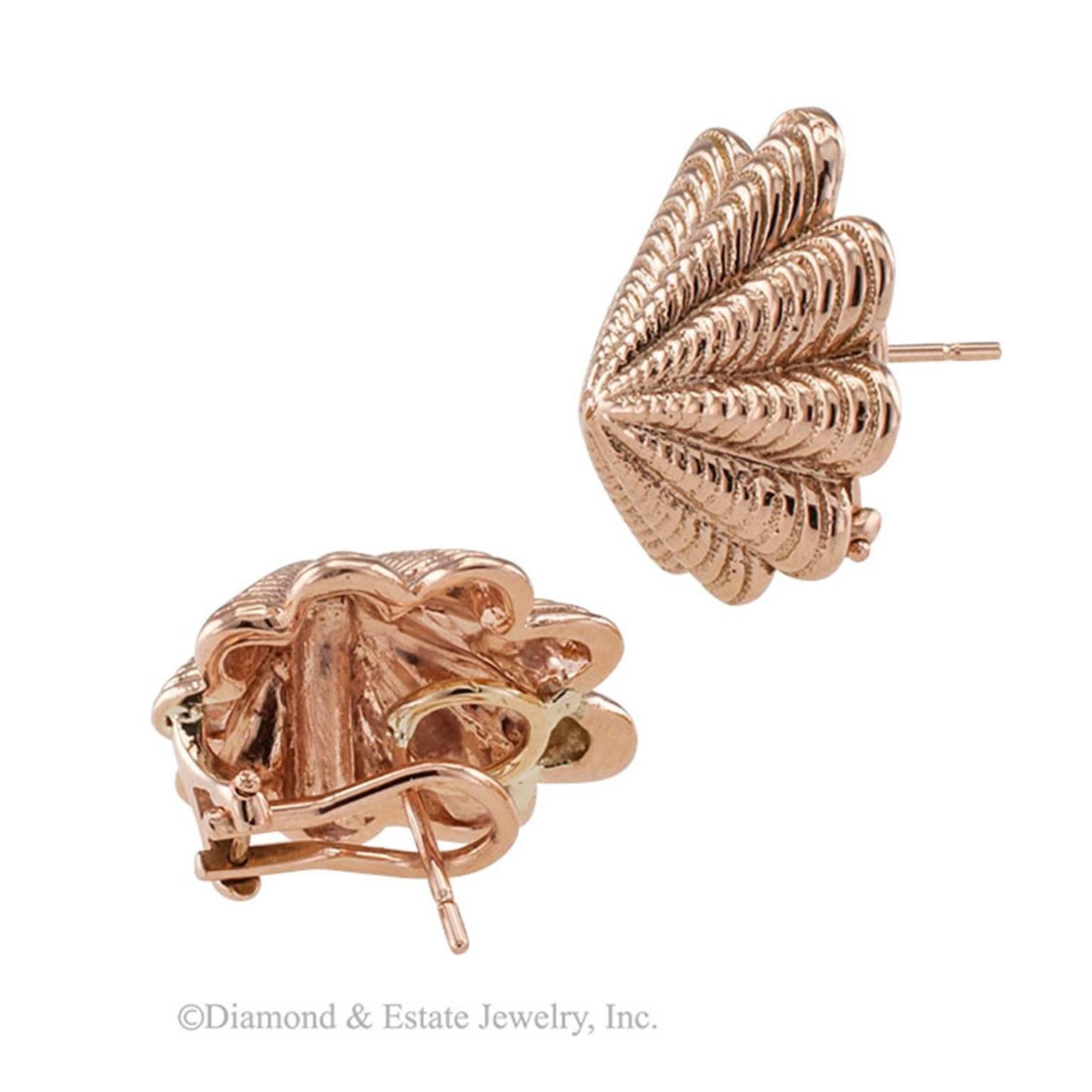 Pink Gold Shell Earrings

Shell design pink gold earrings.  Estate, asymmetric, conical motifs, segmented and fluted to simulate the appearance of a shell crafted in 14-karat pink gold with omega and post backs.
DIMENSIONS:  3/4