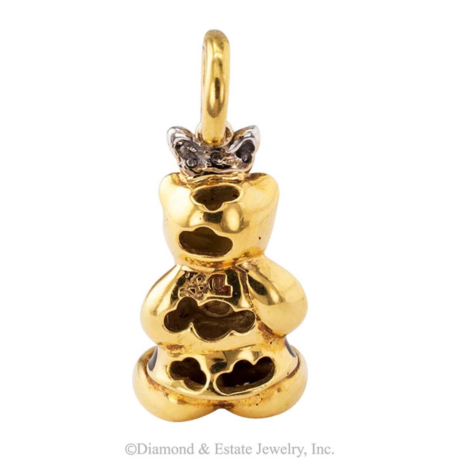 Aaron Basha Enamel Diamond Bear Charm-pendant

Aaron Basha enamel and diamond gold bear charm-pendant.  Decorated with black enamel to enhance facial features and dress and a diamond bow atop the head.
DIMENSIONS:  1 1/4